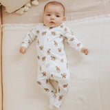 Infant wearing monkey print footed sleeper with two-way zipper Petit Lem