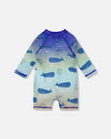 Back view of blue whale print long sleeve one-piece for baby and toddler boys