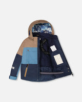 Back view of Teknik jacket and bib pants – Blue Mountains print