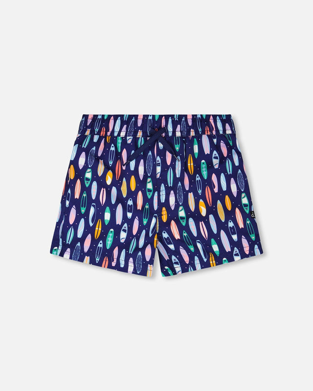 Front flat lay of Deux par Deux boy boardshorts in blue surfboard print