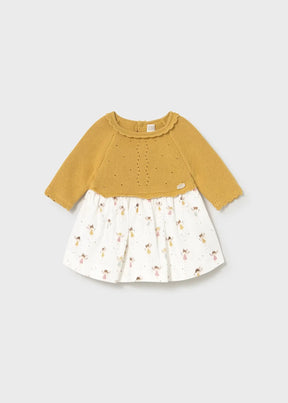 Front view of mustard Mayoral newborn girl knit dress with white animal-print skirt