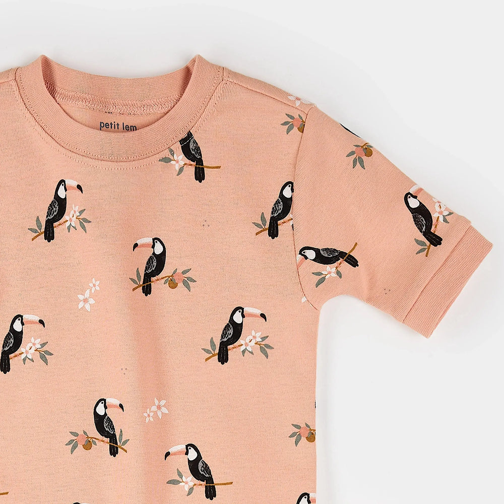 Close-up of toucan print organic cotton fabric on kids summer pajama set