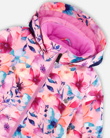 Detail of waterproof zipper pocket and ankle snow gaiter on the one-piece snowsuit