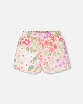Deux par Deux pink French terry shorts with coral, hot pink, lilac and white flowers, sage leaves and an elastic waist