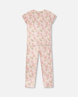 Back view of the women's pink pajama set with short sleeves and long pants