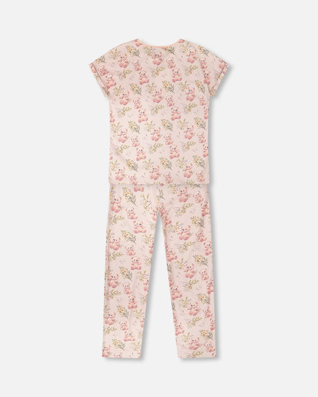 Back view of the women's pink pajama set with short sleeves and long pants
