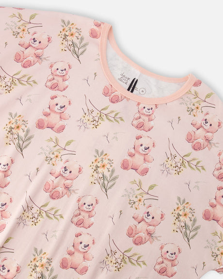 Close-up of the peach trimmed crew neck and teddy bear print on the PJ top