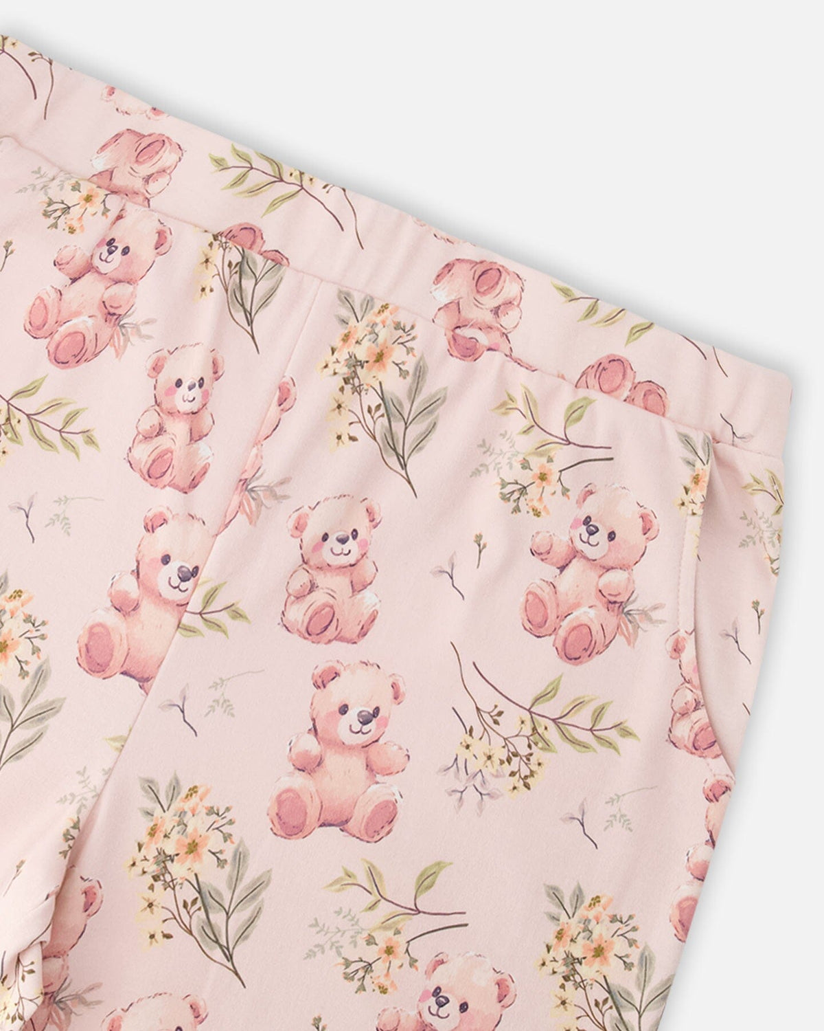 Close-up of the elastic waistband and teddy bear print on the pajama pants