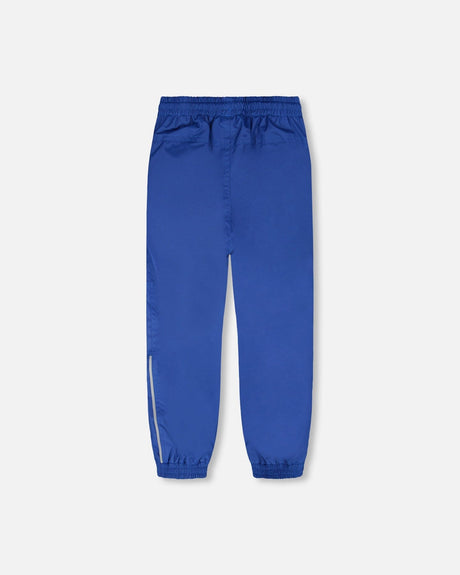 Deux par Deux boys' insulated mid-season set, blue and brown gradient jacket with blue pants – pants, front view