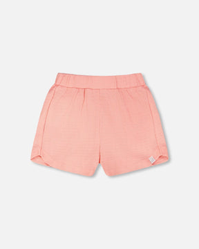 Deux par Deux girls' peach pink crinkle jersey shorts, front view