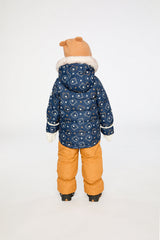 Child wearing the Deux par Deux teddy bear print snowsuit, third lookbook photo