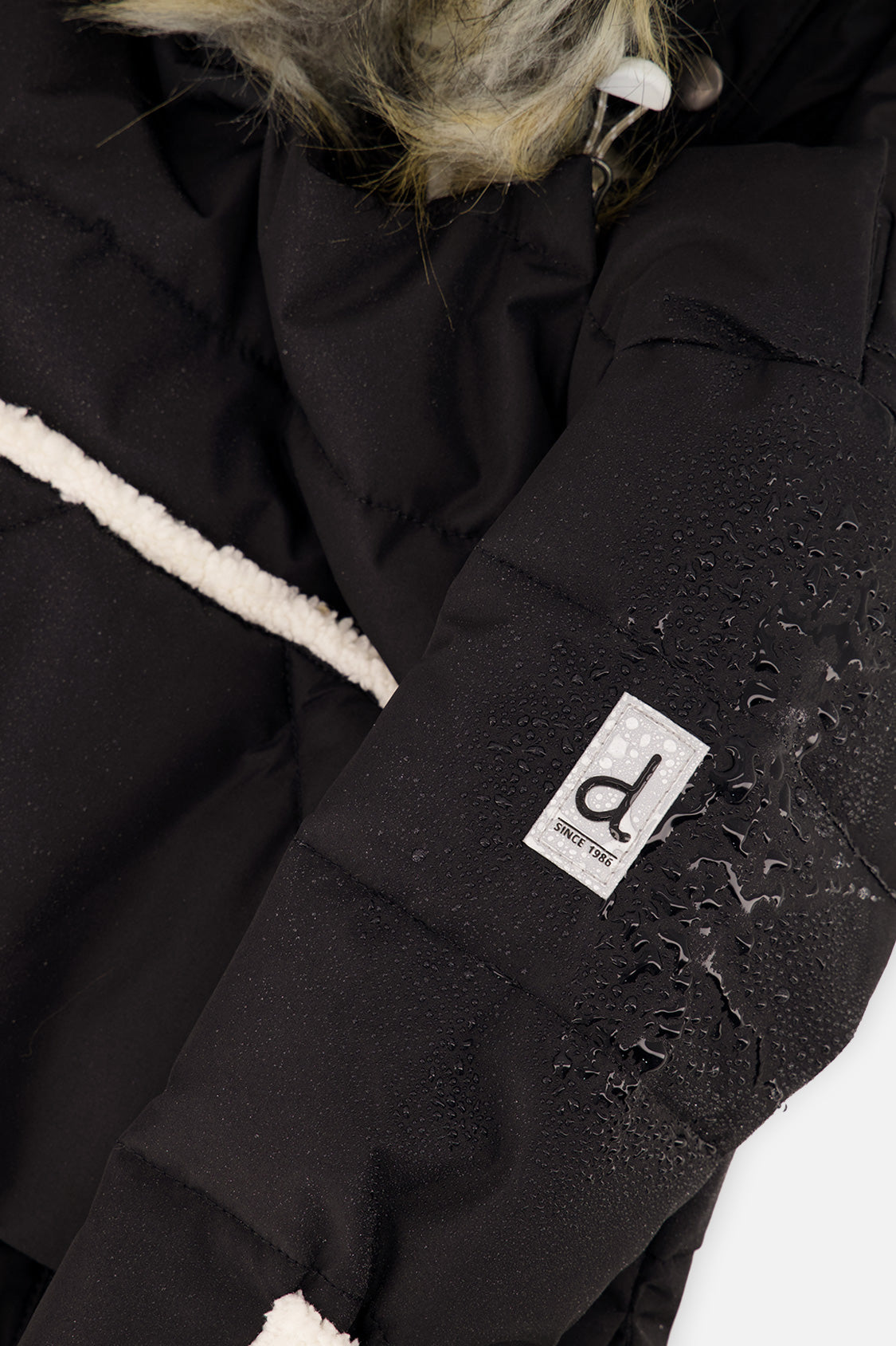 Deux par Deux SNUG baby car-seat snowsuit in black, further studio view