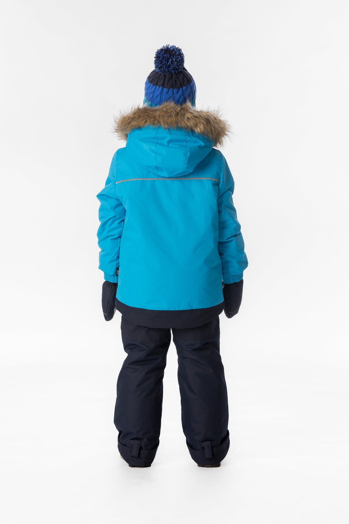 Child wearing the blue Deux par Deux DISCOVER snowsuit, lookbook view 3