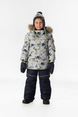 Child wearing the Deux par Deux DISCOVER snowsuit in grey skiing dinosaur print, lookbook view 1