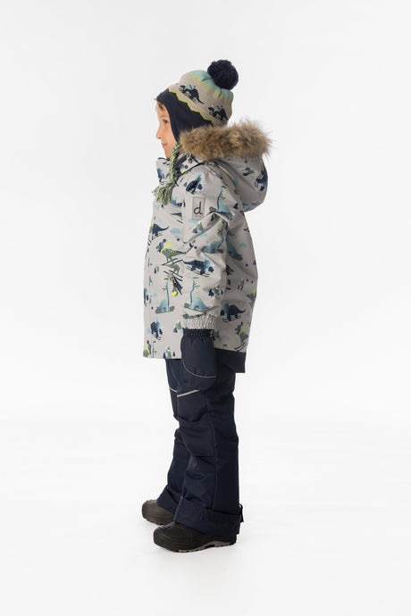 Child wearing the Deux par Deux DISCOVER snowsuit in grey skiing dinosaur print, lookbook view 2