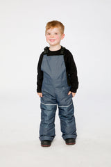 Child wearing the Deux par Deux DISCOVER snowsuit in Blue Bear Print, lookbook view