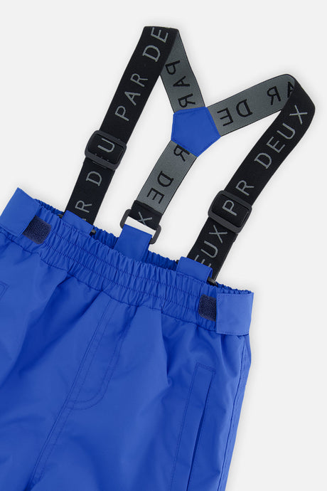 Close-up of the royal blue CHILL snow pants waist and Deux par Deux logo suspenders
