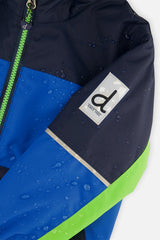 Close-up of the royal blue and green CHILL jacket sleeve logo patch with water beading