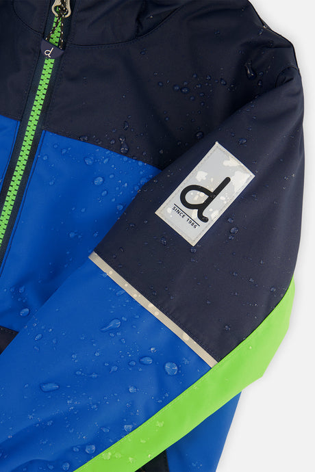 Close-up of the royal blue and green CHILL jacket sleeve logo patch with water beading