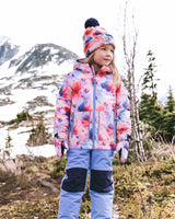 Child wearing the Deux par Deux CHILL snowsuit in Mauve Printed Flowers, lifestyle view