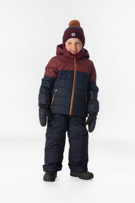 Child wearing the Deux par Deux PLAY snowsuit in navy and burgundy, lookbook view 1
