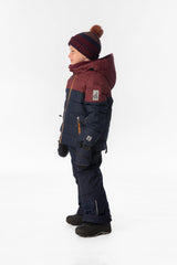 Child wearing the Deux par Deux PLAY snowsuit in navy and burgundy, lookbook view 2