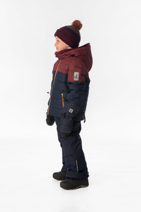 Child wearing the Deux par Deux PLAY snowsuit in navy and burgundy, lookbook view 2