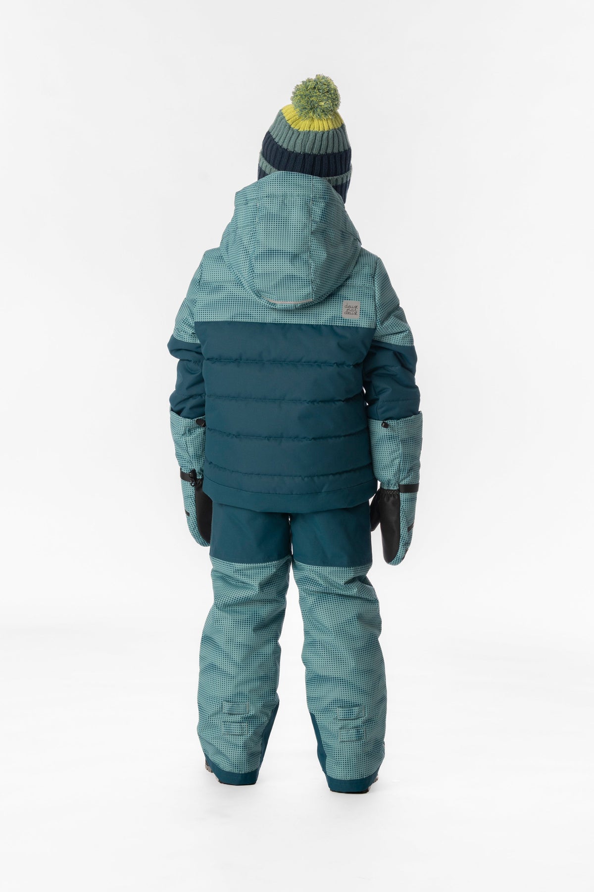 Child wearing the Deux par Deux greyish blue and navy PLAY two-piece snowsuit, lookbook photo 3