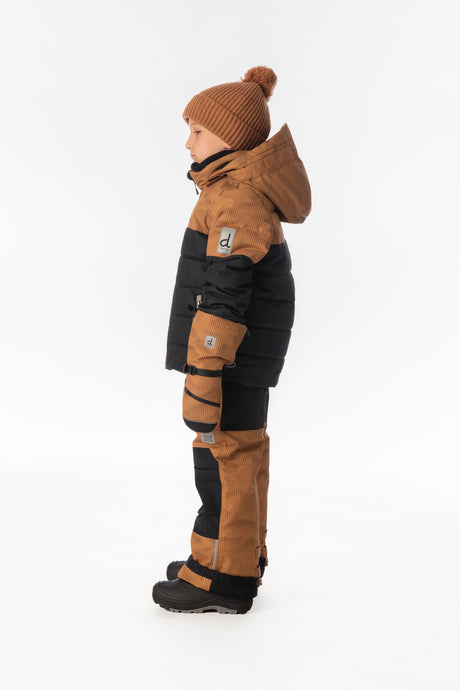 Child wearing the Deux par Deux PLAY snowsuit in brown and black, lookbook view 2