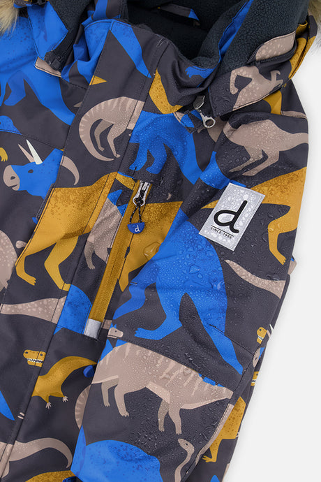 Close-up of the dinosaur-print PLAY jacket front zipper, chest pocket and sleeve logo patch