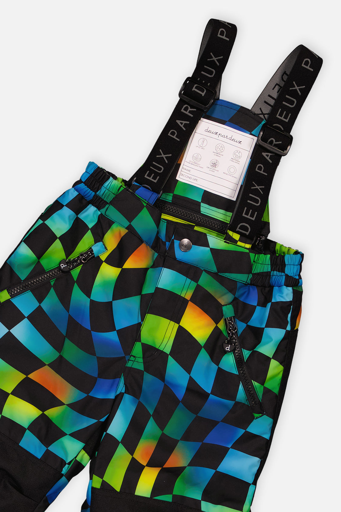 Close-up of the checkerboard snow pants waist, suspenders and zippered pocket