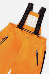Close-up of the orange snow pants zippered pocket and suspenders