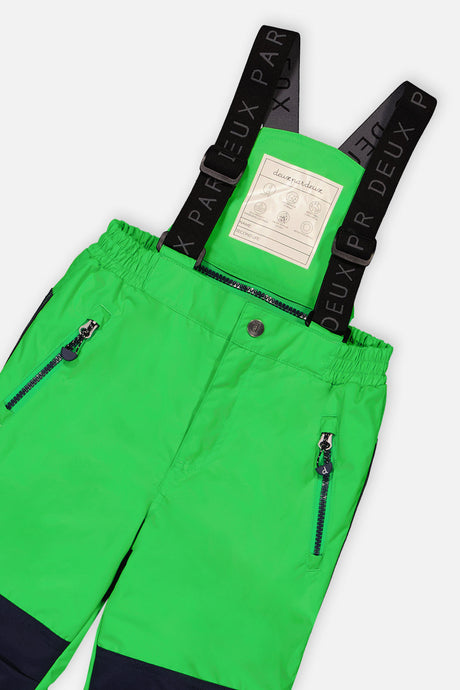 Close-up of the green PLAY snow pants waist, zip pocket and Deux par Deux logo suspenders