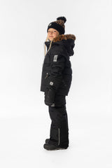 Child wearing the Deux par Deux black PLAY two-piece snowsuit, lookbook photo 2