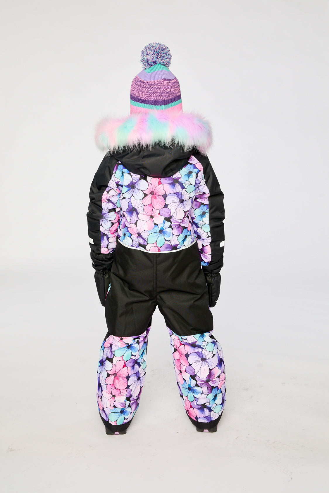 Child wearing the purple floral Deux par Deux snowsuit, lookbook image