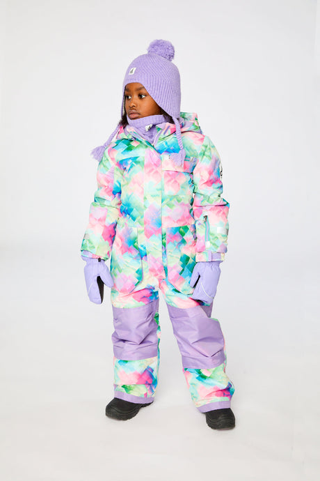 Child wearing the Deux par Deux multicolor diamond print PLAY snowsuit, lookbook view