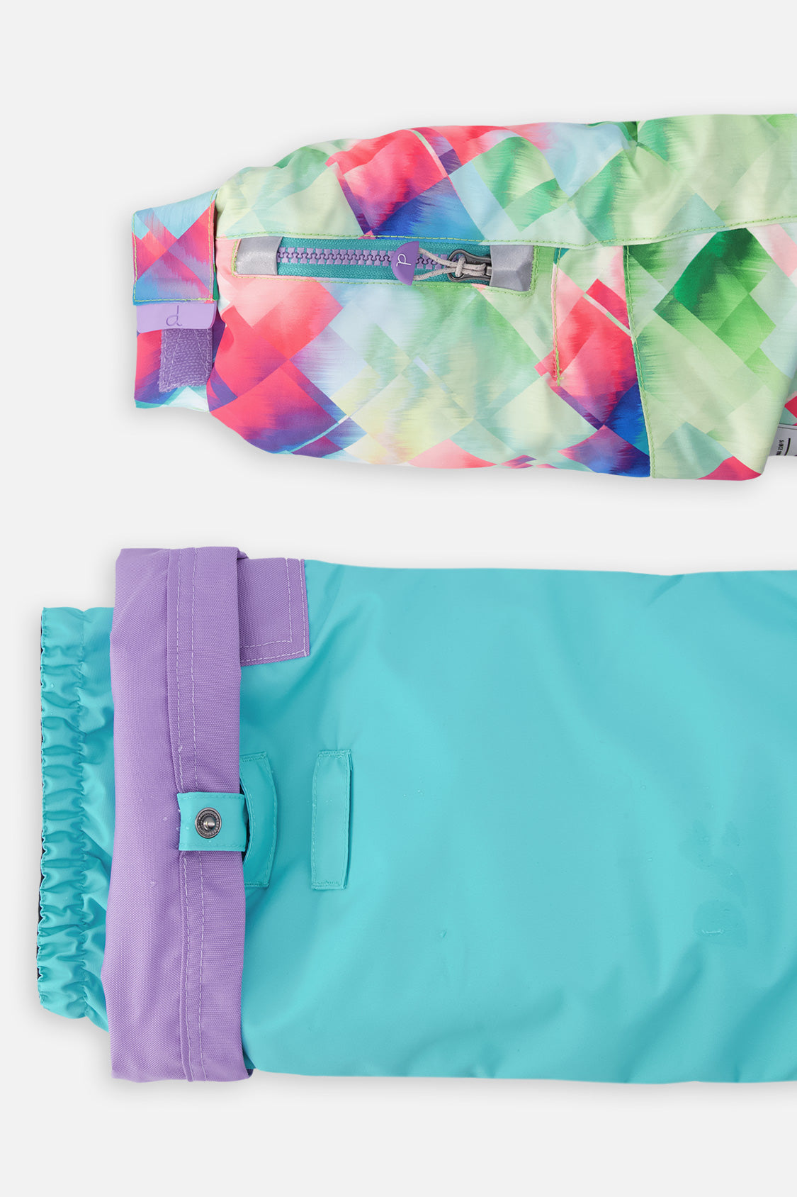 Deux par Deux girls' PLAY snowsuit with diamond-print jacket and turquoise and purple pants, alternate studio shot