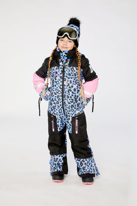 Deux par Deux girls' TEKNIK one-piece snowsuit in blue leopard print – worn by a model