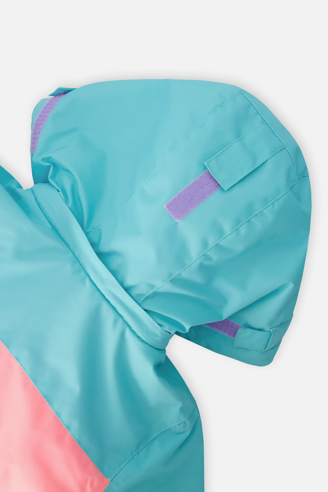 Deux par Deux girls' Teknik two-piece snowsuit in turquoise, orange and mauve color-block – hood close-up