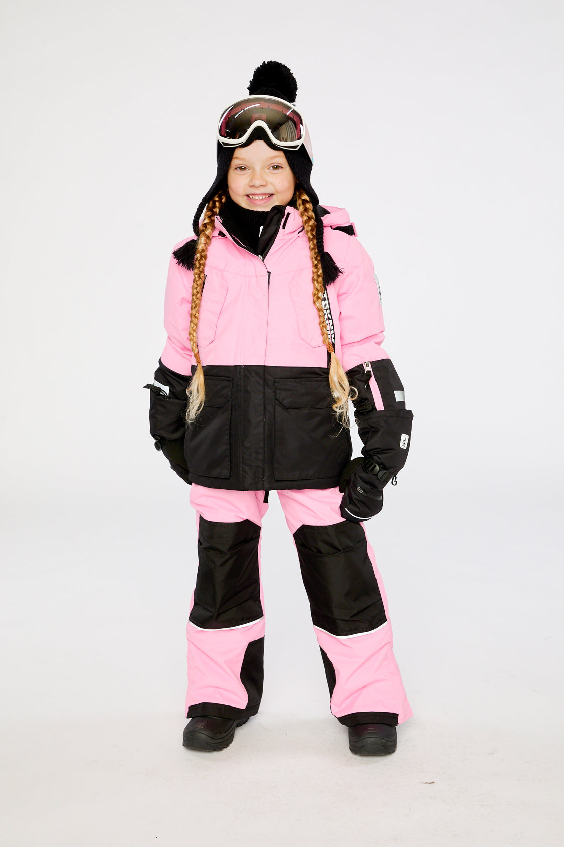 Child wearing the pink Deux par Deux Teknik jacket and snow pants, lookbook photo 1