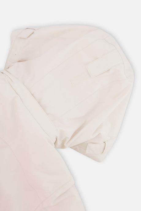 Deux par Deux girls' TEKNIK two-piece snowsuit in off-white and pink, further studio view