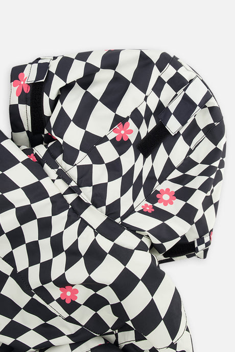 Deux par Deux girls' TEKNIK two-piece snowsuit in white and bright pink checkered print, further studio view