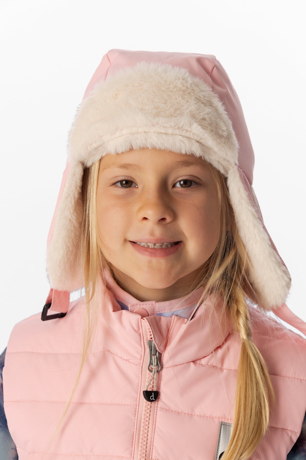 Child wearing the light pink Deux par Deux lined chapka with the ear flaps down, front portrait