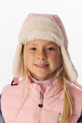 Child wearing the light pink Deux par Deux lined chapka with the ear flaps down, front portrait