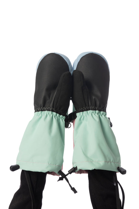 Child wearing Deux par Deux Teknik kids' mittens in mint green, palm side