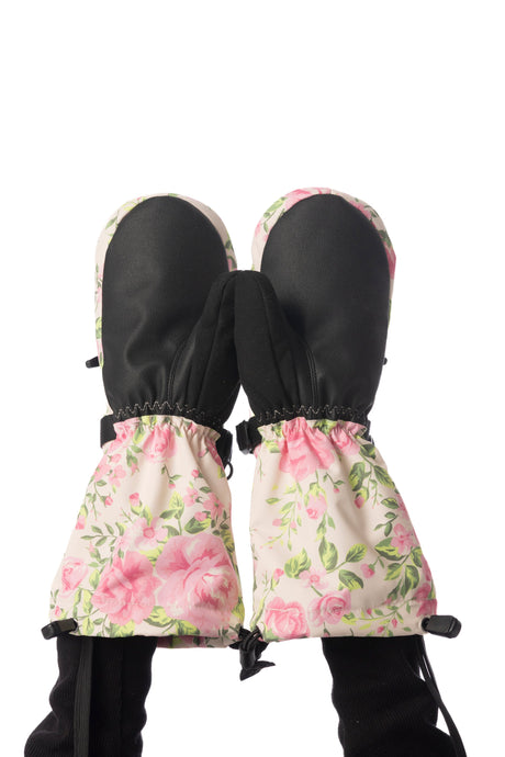 Child wearing Deux par Deux Teknik kids' mittens in beige vintage rose print, palm side