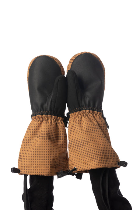 Child wearing Deux par Deux Teknik kids' mittens in brown, palm side