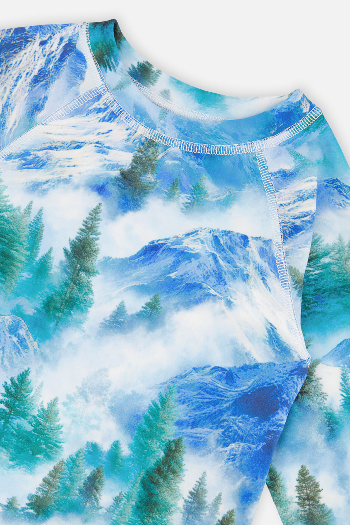 Close-up of the crew neckline and raglan seams on the blue mountain print thermal top from Deux par Deux