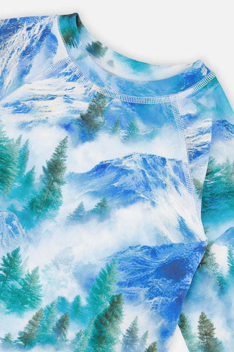Close-up of the crew neckline and raglan seams on the blue mountain print thermal top from Deux par Deux