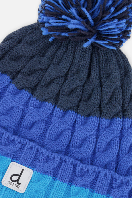 Close-up detail of the dark blue, blue and light blue cable knit on the Deux par Deux hat